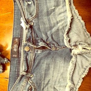 Very worn jean shorts.